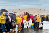Volunteers gather at Westward Ho! beach as part of Earth Action North Devon’s Day of Action, helping to remove litter and plastic pollution from the coastline