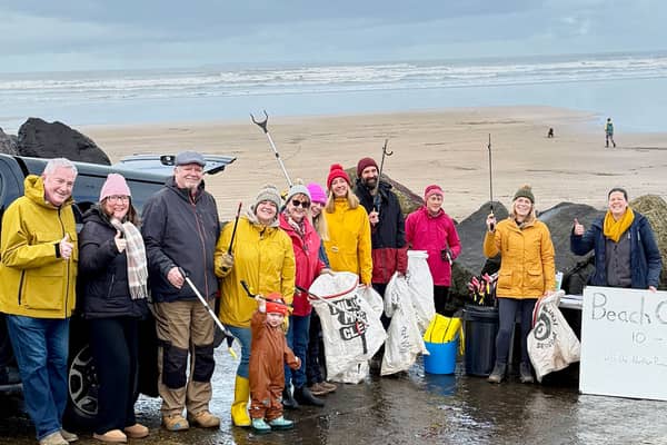 Volunteers gather at Westward Ho! beach as part of Earth Action North Devon’s Day of Action, helping to remove litter and plastic pollution from the coastline