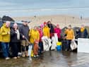 Volunteers gather at Westward Ho! beach as part of Earth Action North Devon’s Day of Action, helping to remove litter and plastic pollution from the coastline