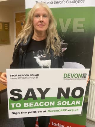 Devon CPRE Director Penny Mills urges people to sign the petition (photo by Sharon Goble)