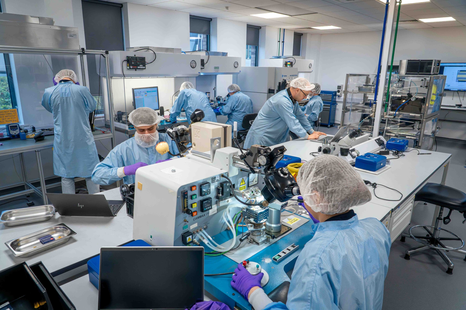 Hands-on learning in action: apprentices work in the Bay Photonics laboratory as part of their training