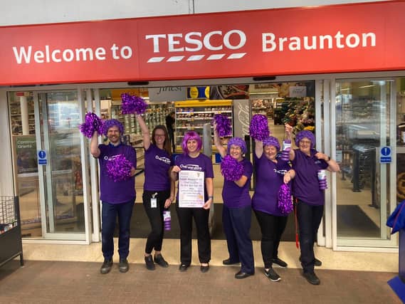 Staff at Tesco Braunton get ready for their Purple Weekend fundraiser in aid of hospital charity Over and Above. Credit: Over and Above