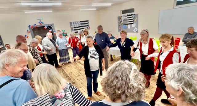 A Breton circle-dancing lesson during the recent visit to Torrington by guests from its twin town of Roscoff.