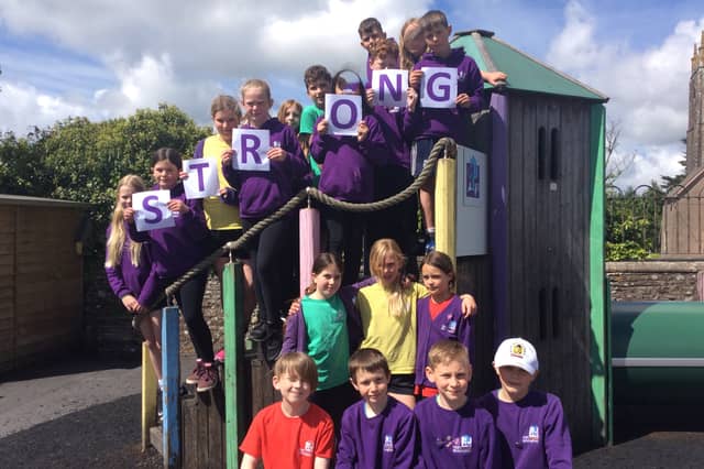 High Bickington Church of England Primary Academy pupils celebrating their school being rated as ‘strong’ across four categories following an Ofsted inspection.