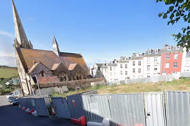 The site is currently a fenced off and vacant lot.