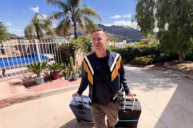 Actor, writer and director Carl Medland, playing himself in his new film Paranormal Hollywood Haunting, arriving at the front door of the mansion featured in the film. Credit: My Production