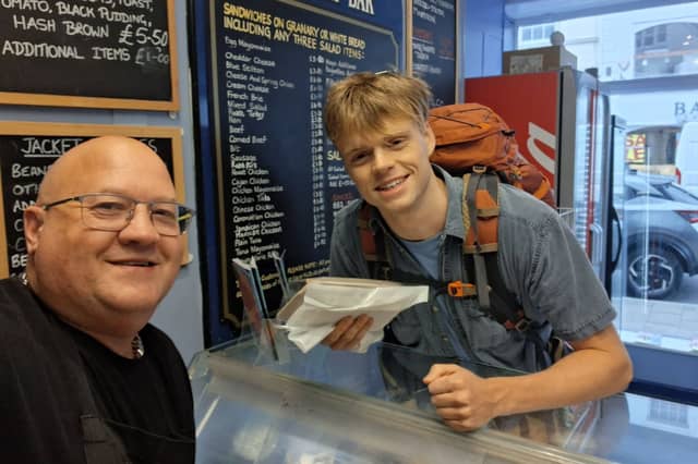 Alexander’s Sandwich Bar owner Nik Edwards with EastEnders star Pierre Counihan-Moullier, who plays Oscar Branning in the hit soap. Credit: Nik Edwards