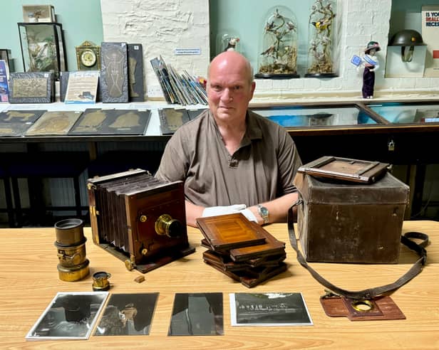 Bryan Shanley pictured at Ilfracombe Museum with the antique Edwardian camera and equipment as well as just a few of the glass plate negatives from the collection of Ilfracombe sign writer and craftsman William Trawin, who died in 1943. 