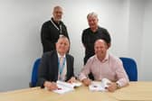 Standing (L-R): Councillor Graham Bell, Lead Member for Housing, North Devon Council. Councillor David Clayton, Leader of the Council, North Devon Council. Sitting (L-R): Jon Triggs, Director of Resources and Deputy Chief Executive, North Devon Council. Martyn Gimber, Chief Executive, North Devon Homes