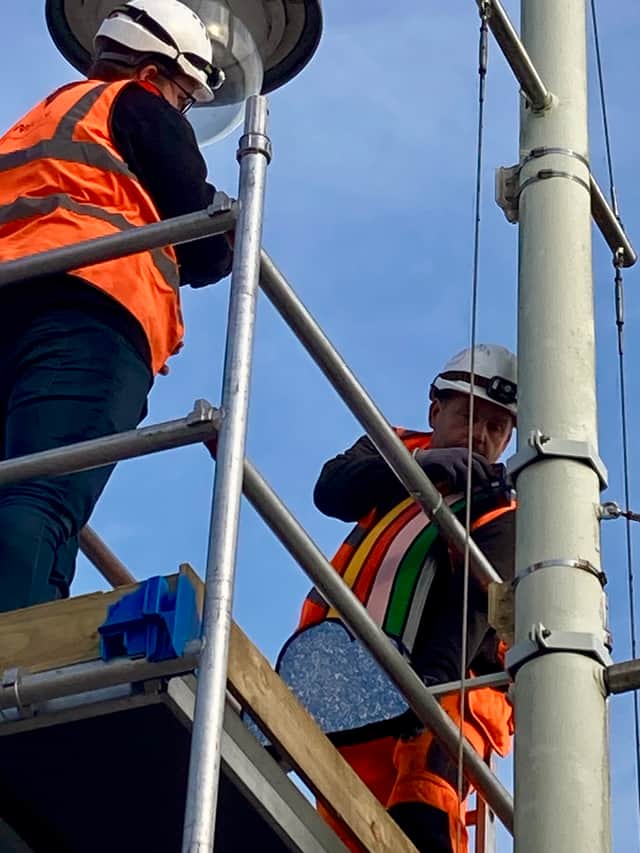 Installing the rainbow artwork opposite Bideford Quay.