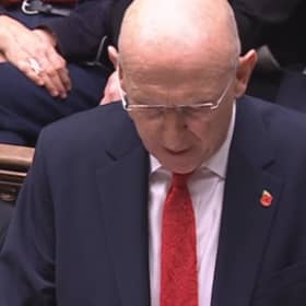 Chancellor John Healey delivering his Budget in Parliament