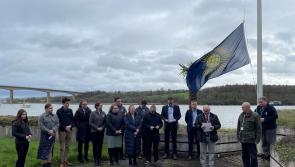 Work experience students and a flag raising ceremony at Riverbank House