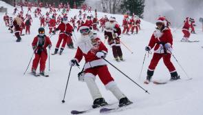 300 skiing Santas, a Grinch and a tree take to slopes to spread Christmas cheer