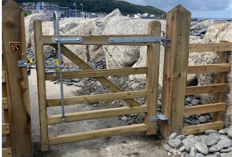 The new gates incorporate 'trombone style handles' allowing footpath users to open the gates with ease - Credit: TDC