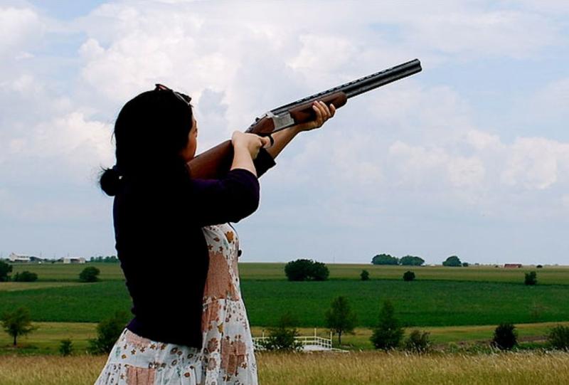 A woman firing a 20 gauge double barrel shotgun in the countryside - Credit: Valerie Hinojosa