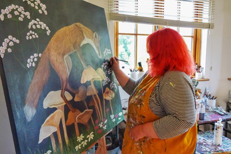 Kelly Stevens-McLaughlan with some of her art
