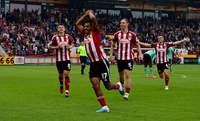 Exeter's Caleb Watts celebrates. PPAUK