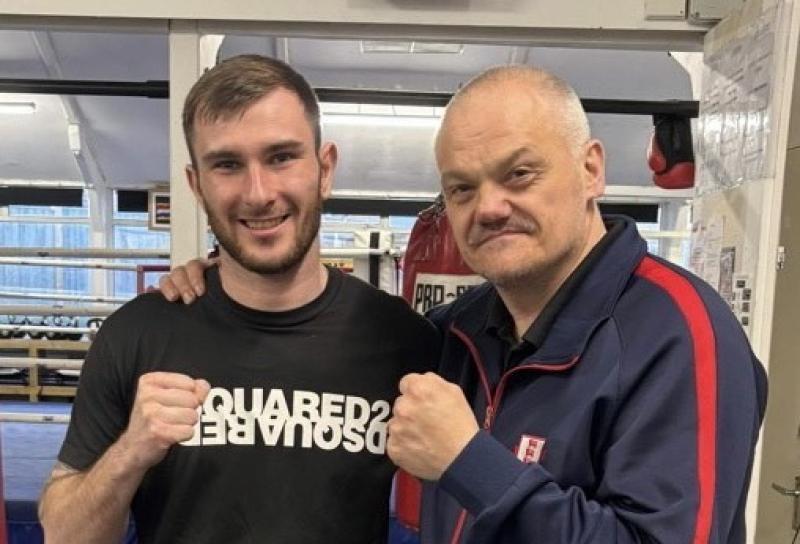 Alex Dovell with England coach Craig Turner