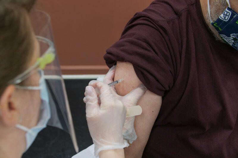 A spring covid vaccine booster being administered - Credit: DCC