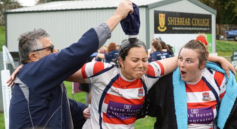 Tony Picillo (Physio) pouring ice cold water over debutant Catherine Bradborn. Pic from Kevin Crowl