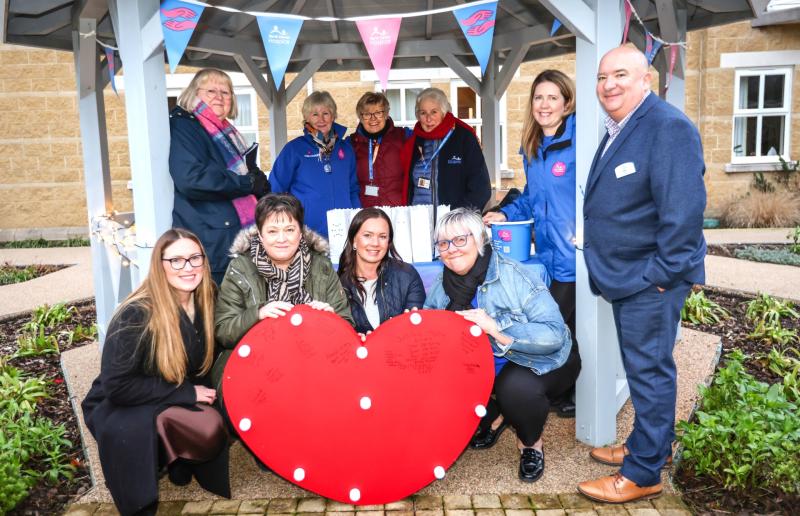 Community gathers for candles on the lake