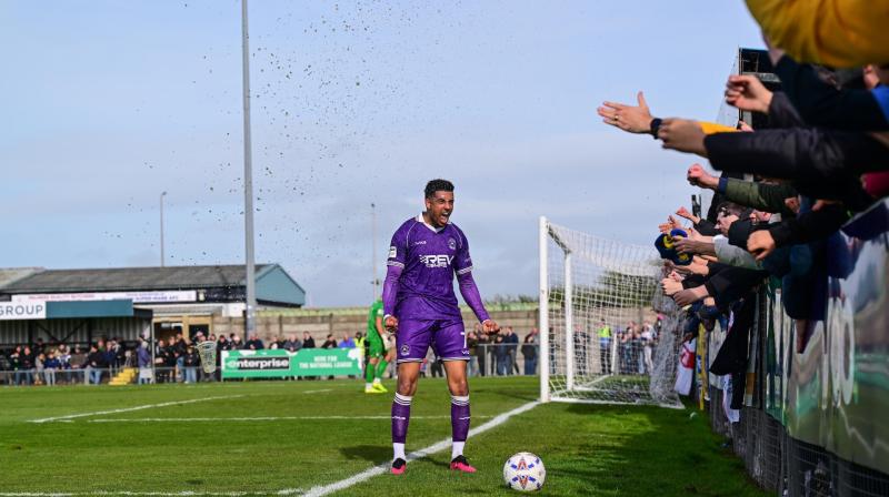 Louis Dennis celebrates with the Yellow Army. Pic from PPAUK