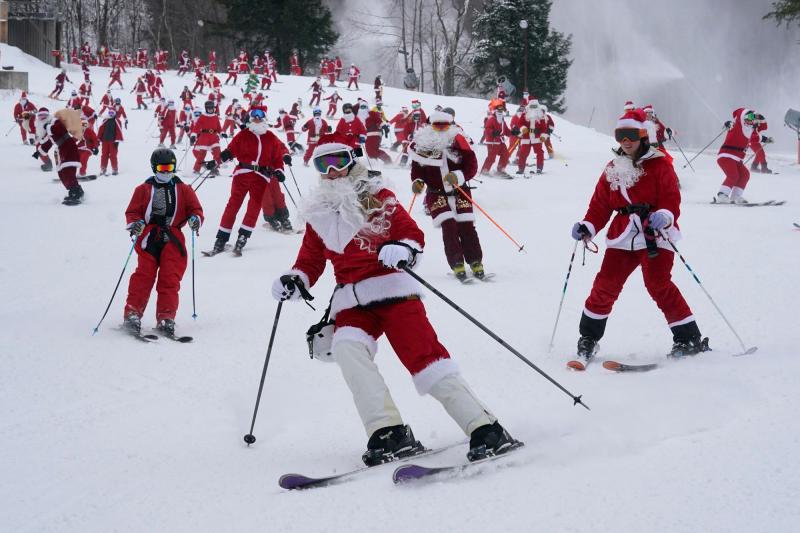 300 skiing Santas, a Grinch and a tree take to slopes to spread Christmas cheer