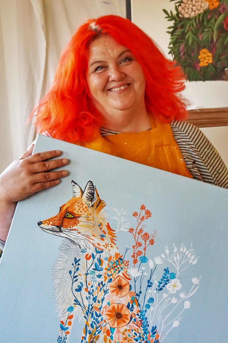 Kelly with some of her art