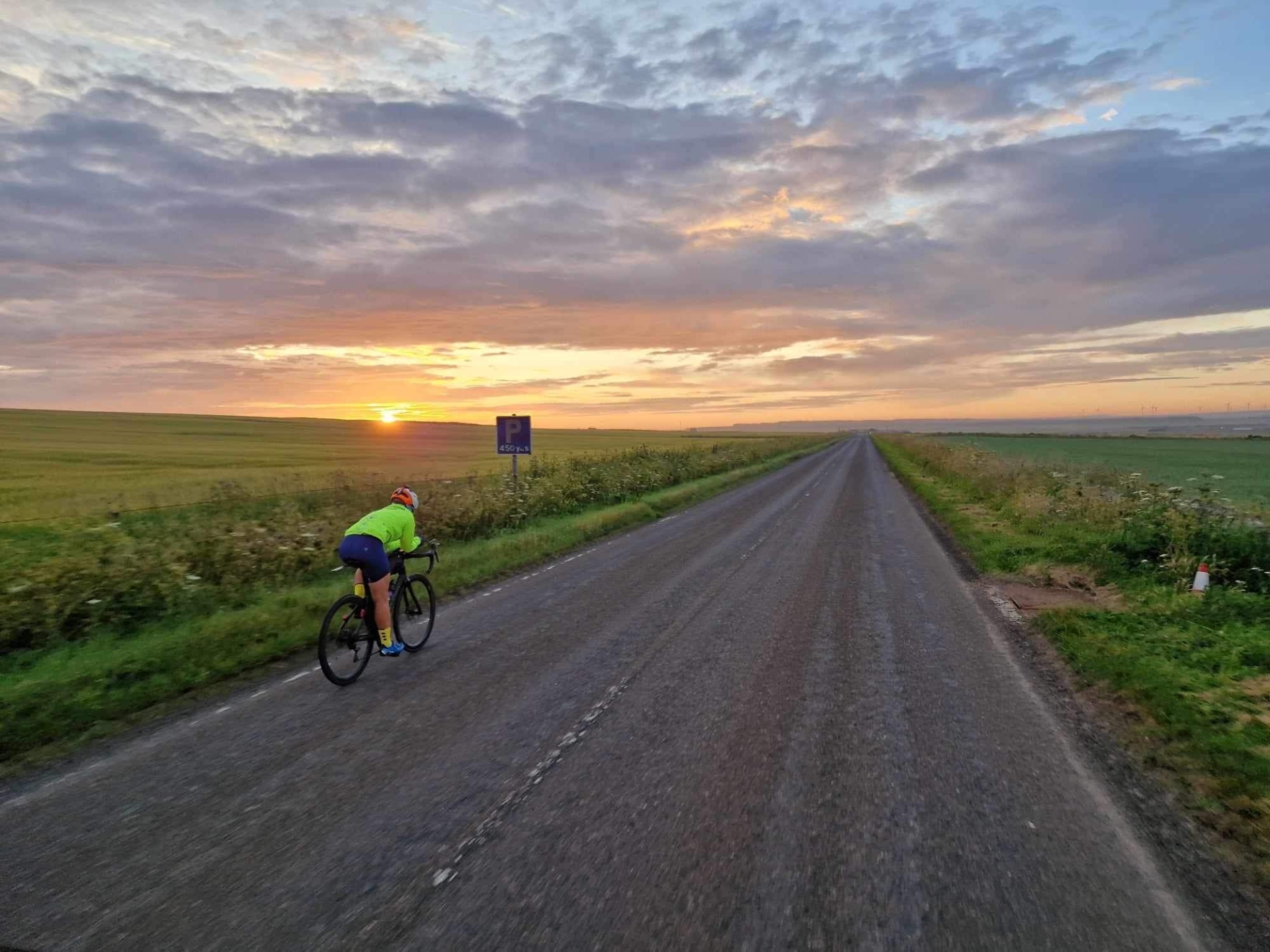 Louise Harris on the road during her epic record breaking cycle from Land's End to John O' Groats, and back. Credit: Glyn Brackenbury