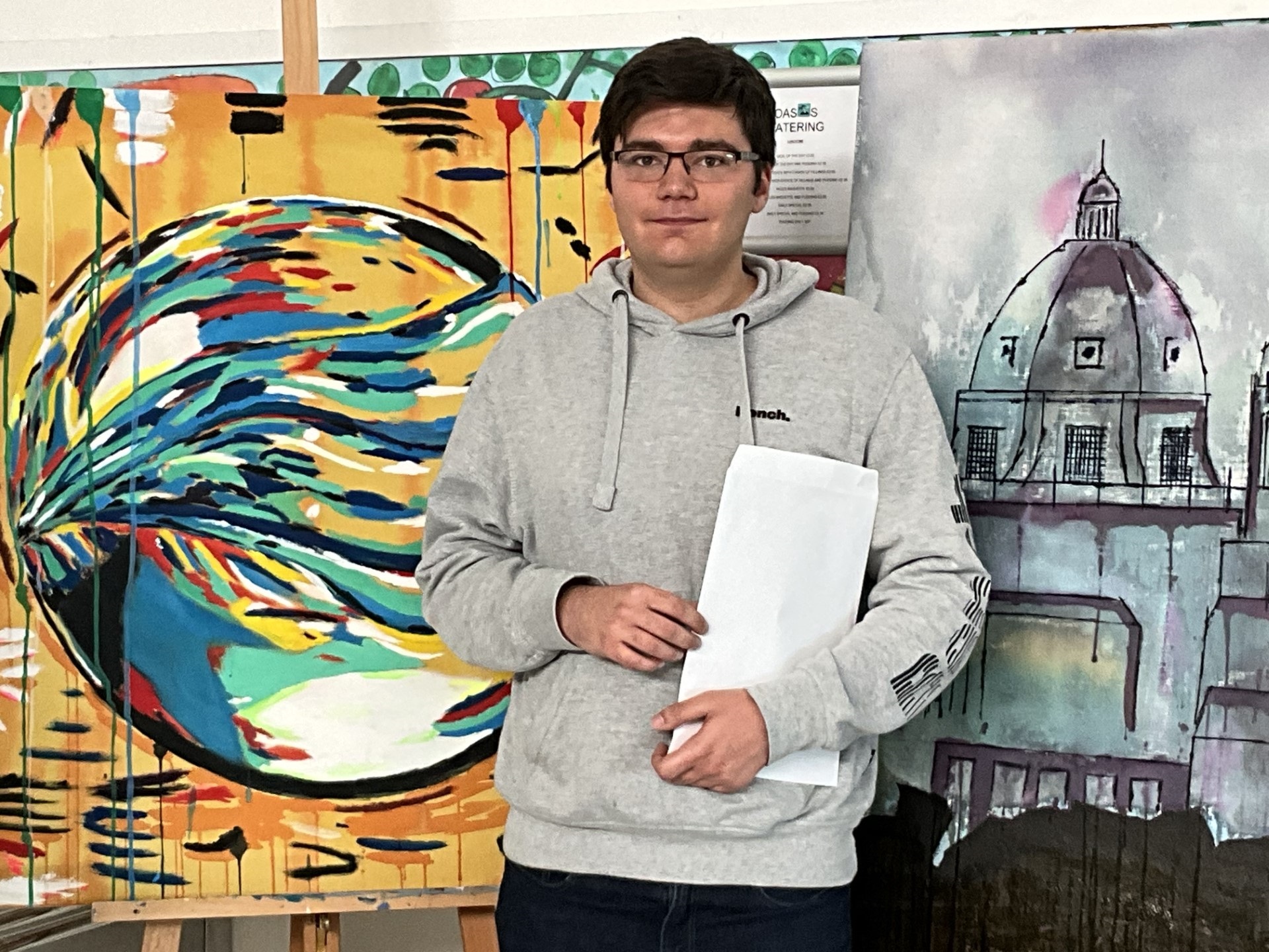 Logan Jago with his artwork