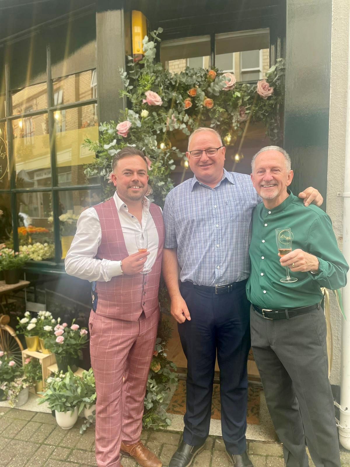North Devon Council Leader and Liberal Democrat Parliamentary Candidate Ian Roome (centre) with Ollie and Mark from Dingles Florists - Credit: Submitted