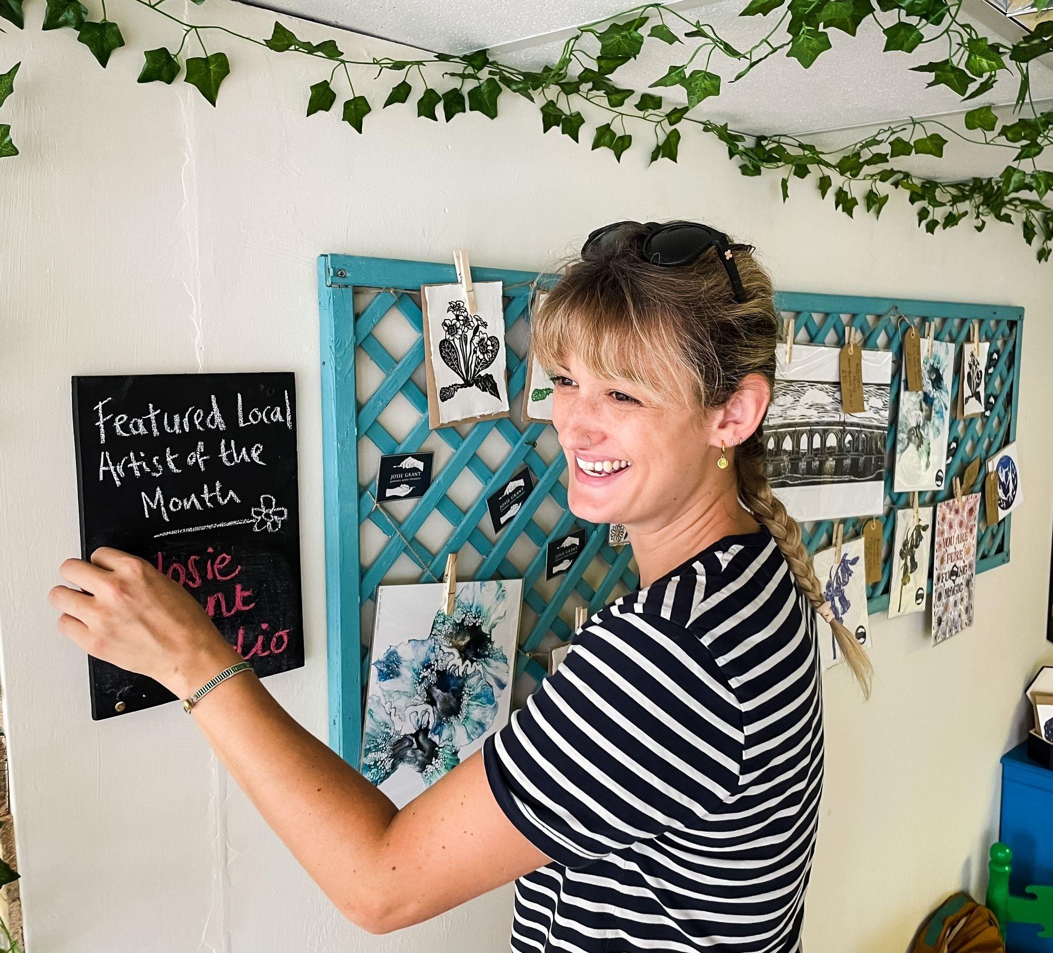 Josie Grant setting up an exhibition - Credit: Submitted