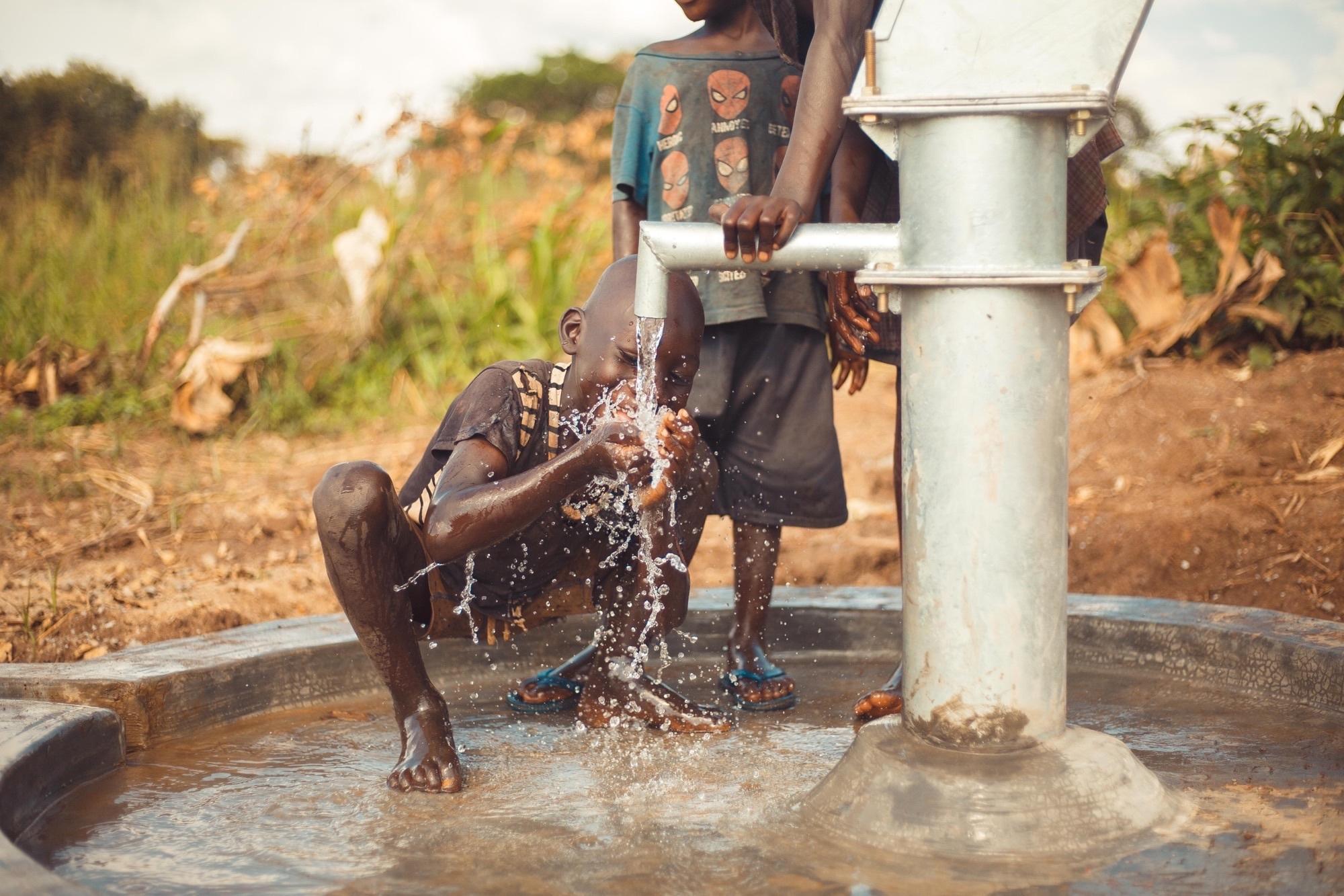 An Amigos funded borehole in action - Credit: Amigos