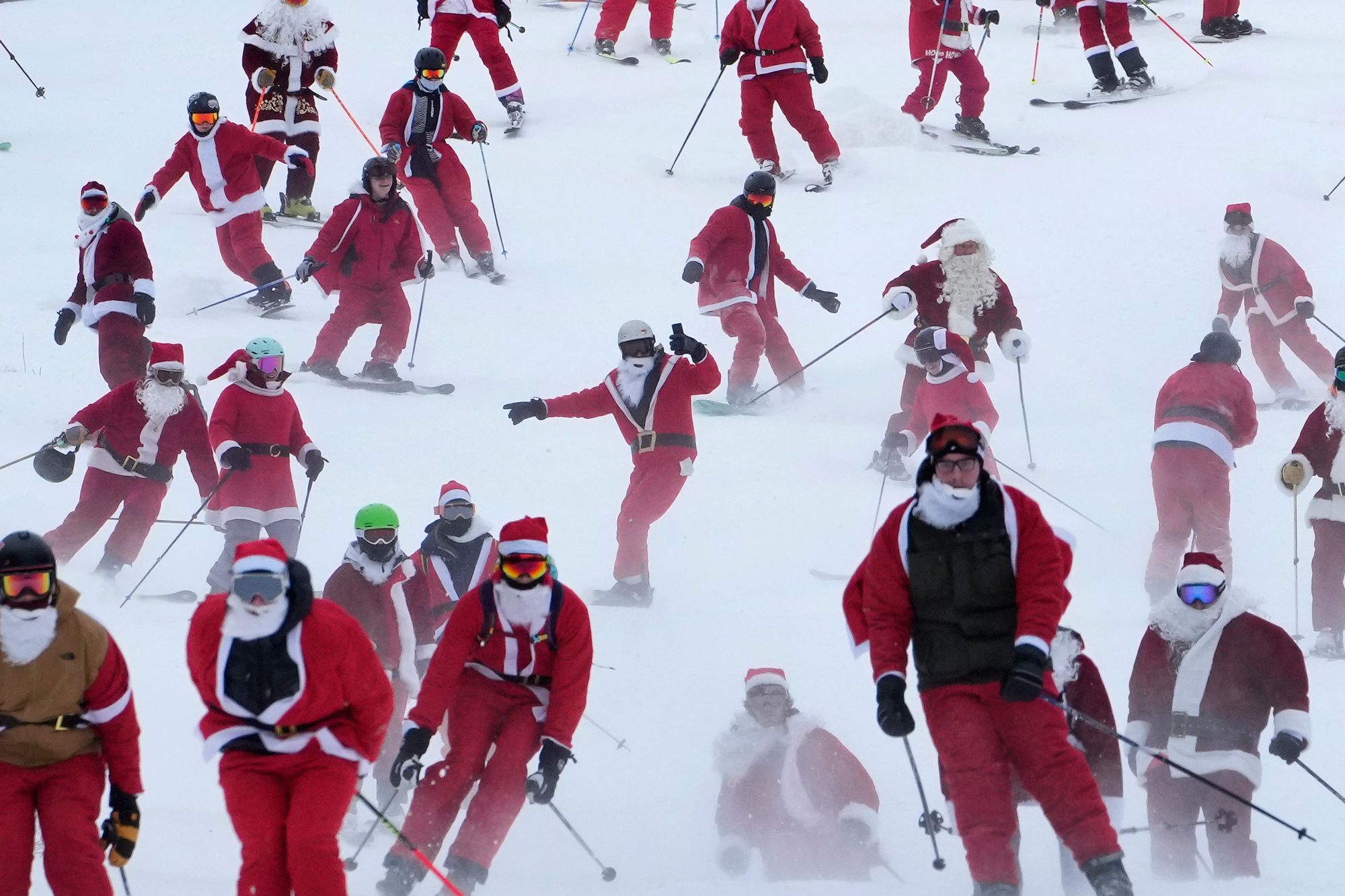 Some of the 300 skiers registered for the annual charity ski run descend the slopes at the Sunday River Ski Resort in Newry, Maine