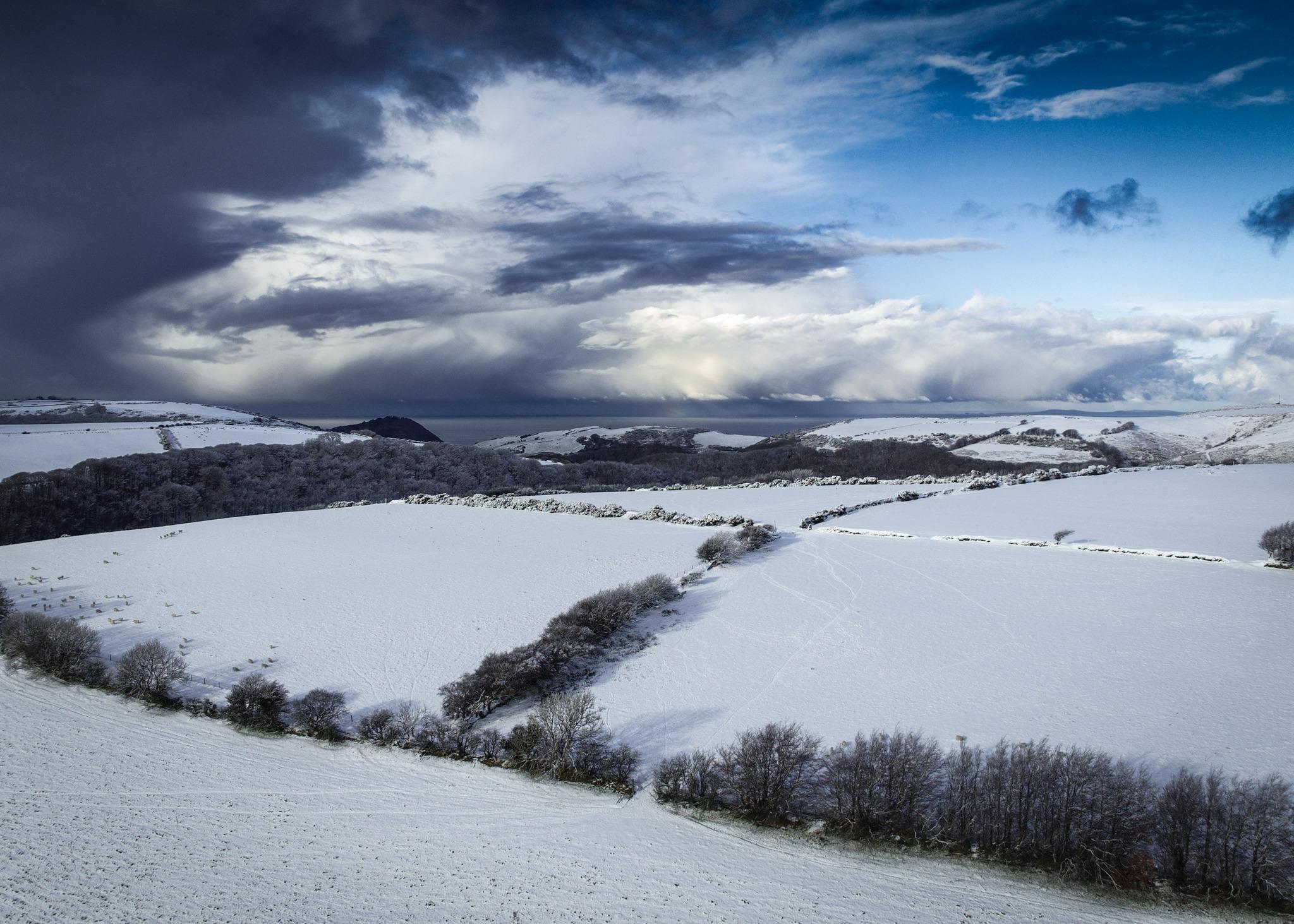 A snowy view of Exmoor looking towards Lynton & Lynmouth. Credit: Tom Johnson