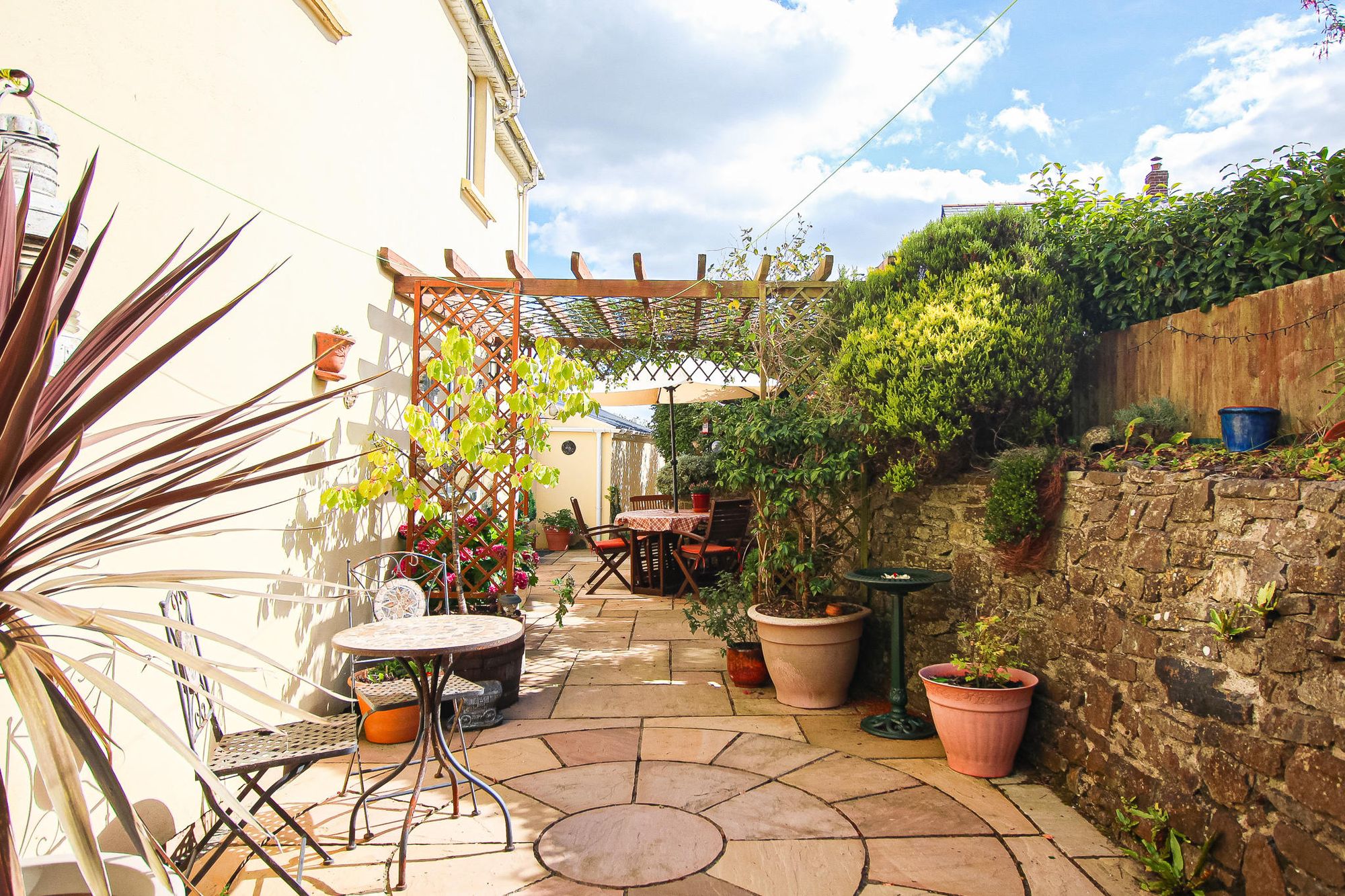 The secluded rear garden is easy maintenance yet a pleasant spot to sit and enjoy. Credit: Brights