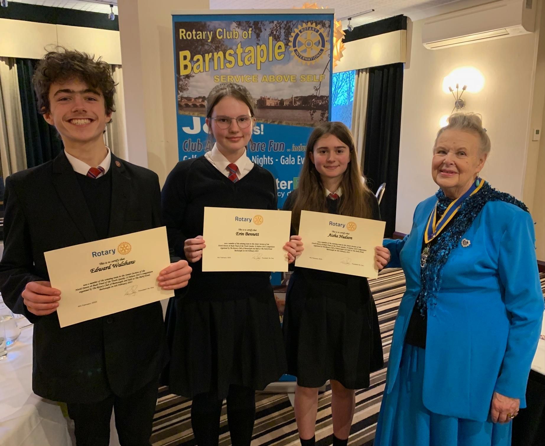 The Bideford College Youth Speaks team of Edward Walshaw, Erin Bennett and Aisha Hudson, with Rotarian Ro Day.