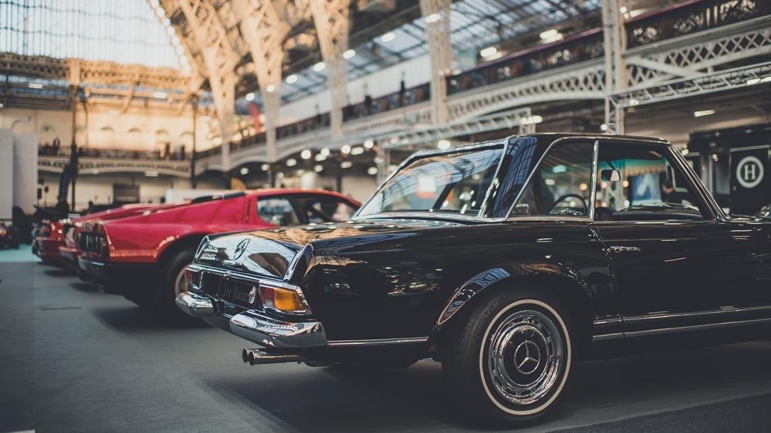 Cars on parade at the London Classic Car Show. Credit: Olympia London/London Classic Car Show