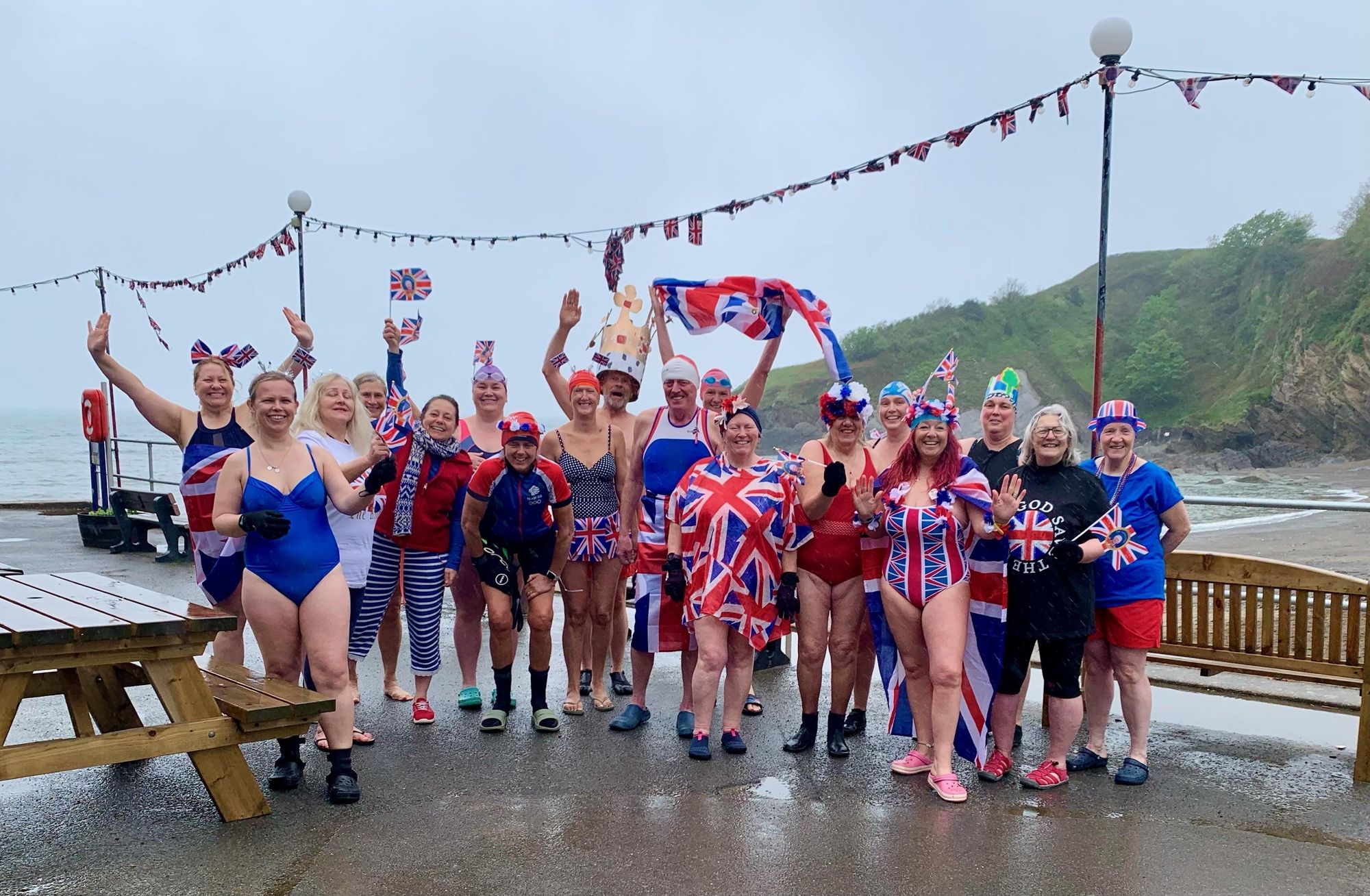 The Hele Bay Merbabes in regal swimsuit attire before a coronation dip on Saturday at Hele. Credit: Terri Ingram