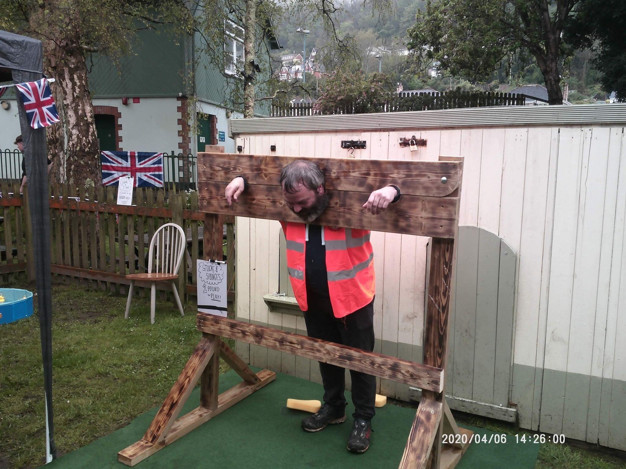 In the stocks for high treason during a coronation picnic in the park at Bicclescombe in Ilfracombe: Credit: Bicclescombe Mill