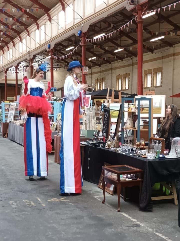 Stilt walkers at the South Molton Pannier Market as part of the town’s coronation events. Credit: Liz Barrett