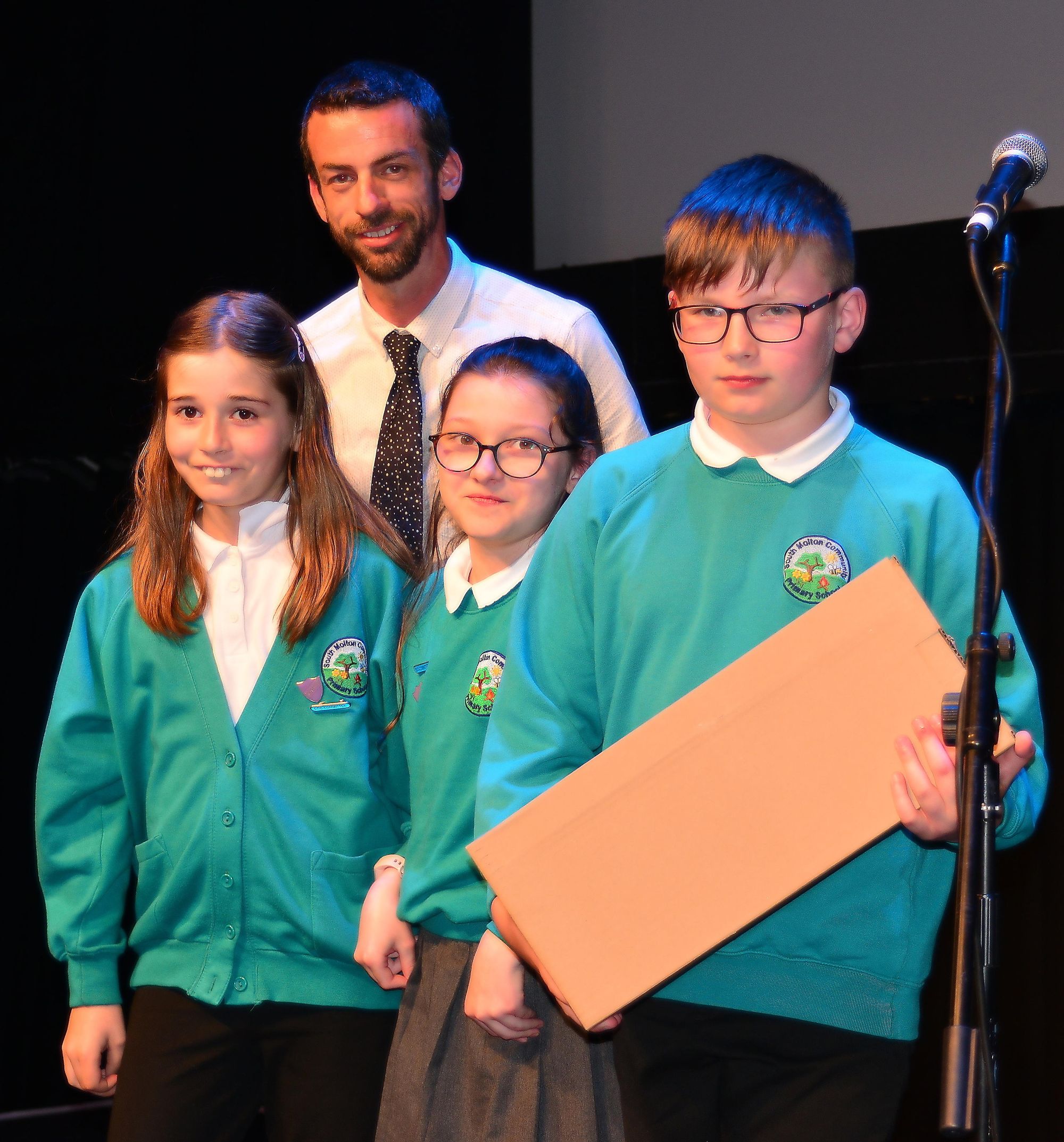 Primary School Award winners, South Molton Primary School. (b) Tom Parkin, Head teacher (f) Ruby, Lottie & Riley - Credit: Carl Klinkenborg